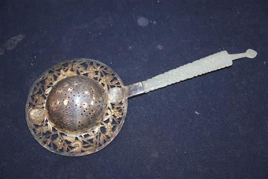 A Chinese white metal and enamel tea strainer, with pierced jade handle, 22cm.